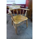 A Victorian elm smokers bow chair