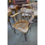 A Victorian elm smokers bow chair