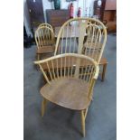 An Ercol blonde elm and beech armchair