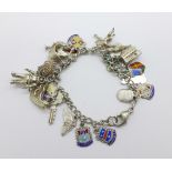 A silver charm bracelet including an astronaut charm, 53g