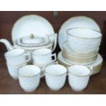 A set of 1820's porcelain including five trios and spare cups, a teapot, side plates, bowls, etc. (