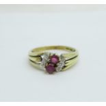 An 8ct gold ring set with six diamonds and two rubies, marked 333, 2.4g, M