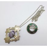 A silver gem set Celtic pendant and chain and a Celtic brooch set with malachite