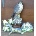 A Royal Doulton limited edition Peregrine Falcon and three other models of birds, one model of