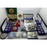 A large collection of British and foreign coins, commemorative sets including 1976 Olympics,