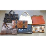A collection of seven handbags including snake skin