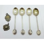 Four silver spoons and two silver fobs including one football, 51g
