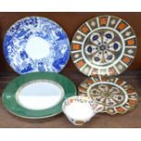 A collection of Royal Crown Derby china, four plates and a cup - all second quality