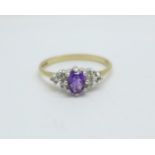 A 9ct gold, amethyst set ring with diamond shoulders, 1.6g, N