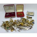 A collection of cufflinks and tie-pins