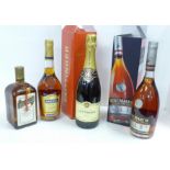 Four bottles; Cointreau, Remy Martin champagne cognac, Martel brandy and Taittinger champagne