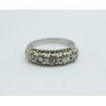 A white metal set five stone diamond ring, marked 18ct, 4.8g, N