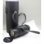 A Bell & Howell camera lens, 1:4.5 80-205mm, No.3004399