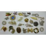 Twenty-seven costume brooches, three lacking pins