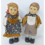 A pair of Goebel style boy and girl dolls, 26cm