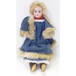 A German Armand Marseille bisque head doll with blue sleep eyes, 3200 AM2 DEP identification mark,