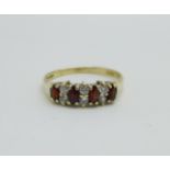 A 9ct gold, garnet and white stone ring, 1.6g, M