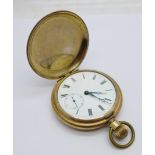 A gold plated pocket watch, lacking glass, case worn