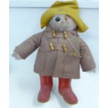 A Gabrielle Designs Paddington Bear figure with red Dunlop Wellington boots, clothing with moth