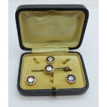 A blue enamel and pearl brooch and three button set, cased