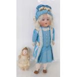 A German Schaeun & Hoffmeister bisque head doll with blue sleep eyes, 1909-8 identification mark,