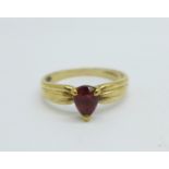 A 9ct gold, pear shaped garnet solitaire ring, 2.2g, P