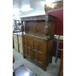 A carved Ipswich oak court cupboard