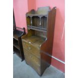 An Arts and Crafts oak and pine side cabinet