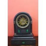 A large 19th Century French Belge noir and malachite set mantel clock