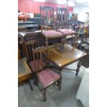 An oak draw-leaf table and four chairs