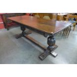 A 17th Century style carved oak refectory table