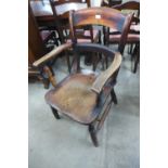 A Victorian elm and beech elbow chair