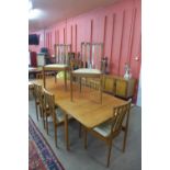 A McIntosh teak double leaf extending dining table and eight chairs