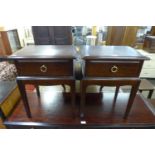 A pair of Stag Minstrel mahogany bedside tables
