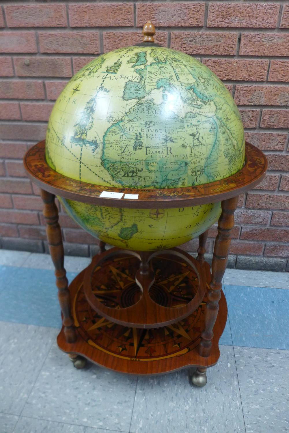 A terrestrial globe cocktail cabinet/trolley