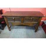 A 17th Century style carved oak two drawer dresser