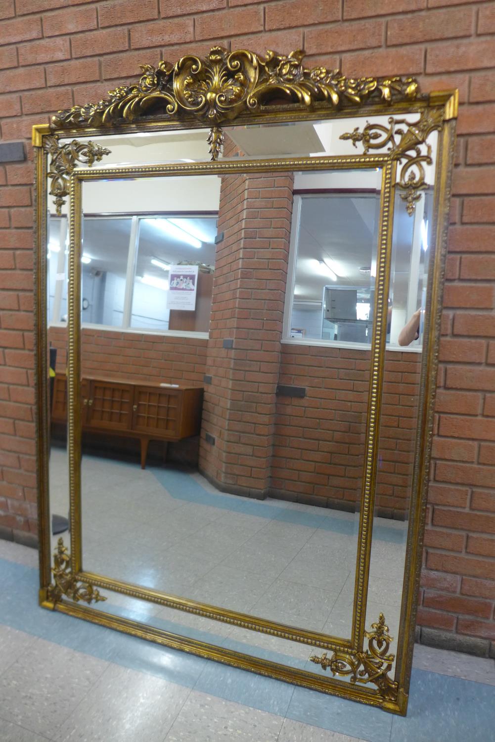 A large French style gilt framed mirror with crest, 191 x 135cms (M24238) #