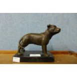 A small bronze Staffordshire bull terrier, on black marble socle