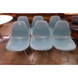 A set of six Charles and Ray Eames chrome and Perspex Vitra chairs