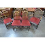 A set of six Jacobean Revival carved oak chairs