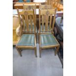 A set of four Arts and Crafts oak chairs