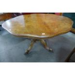 A Victorian figured walnut serpentine tilt top breakfast table