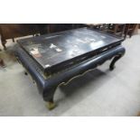 An oriental chinoiserie ebonised coffee table (lacking glass )