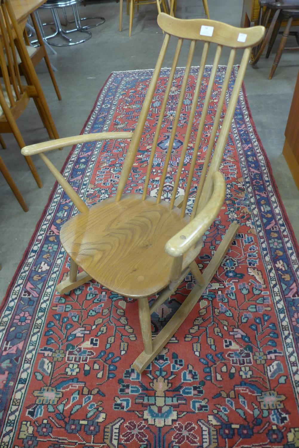 An Ercol Blonde elm and beech child's Goldsmith rocking chair