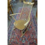 An Ercol Blonde elm and beech child's Goldsmith rocking chair