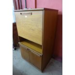 A teak cocktail cabinet