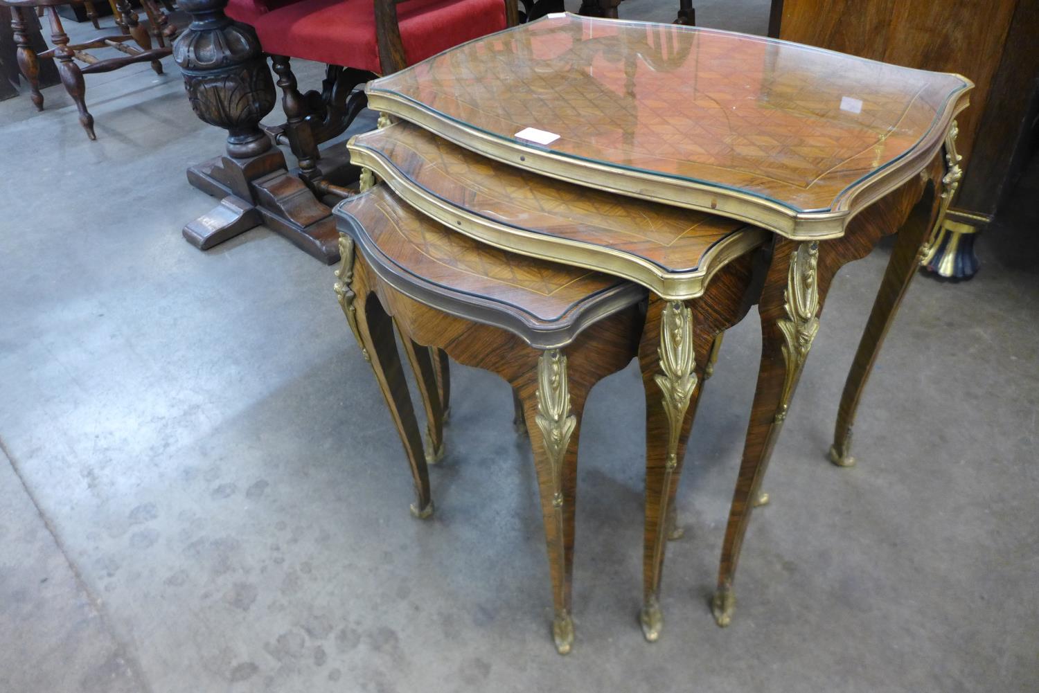 A French Louis XV style parquetry inlaid rosewood and ormolu mounted nest of tables