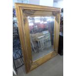 A large gilt framed mirror