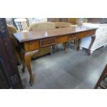 A hardwood three drawer serving table