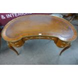 A French Louis XV style parquetry inlaid kingwood and ormolu mounted kidney shaped writing table